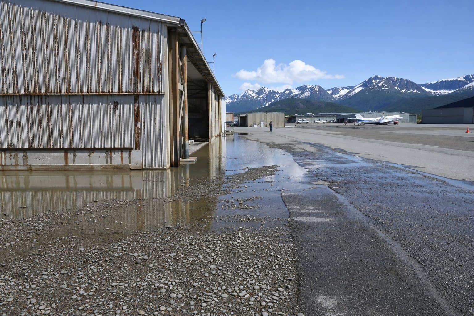 Cover image for article: Juneau airport hangar owners say regrading sent water into their buildings
