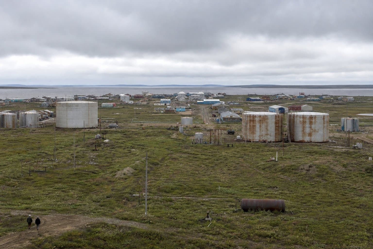 Cover image for article: In Koyuk, old fuel tanks left petroleum in the ground. Now someone will measure it.