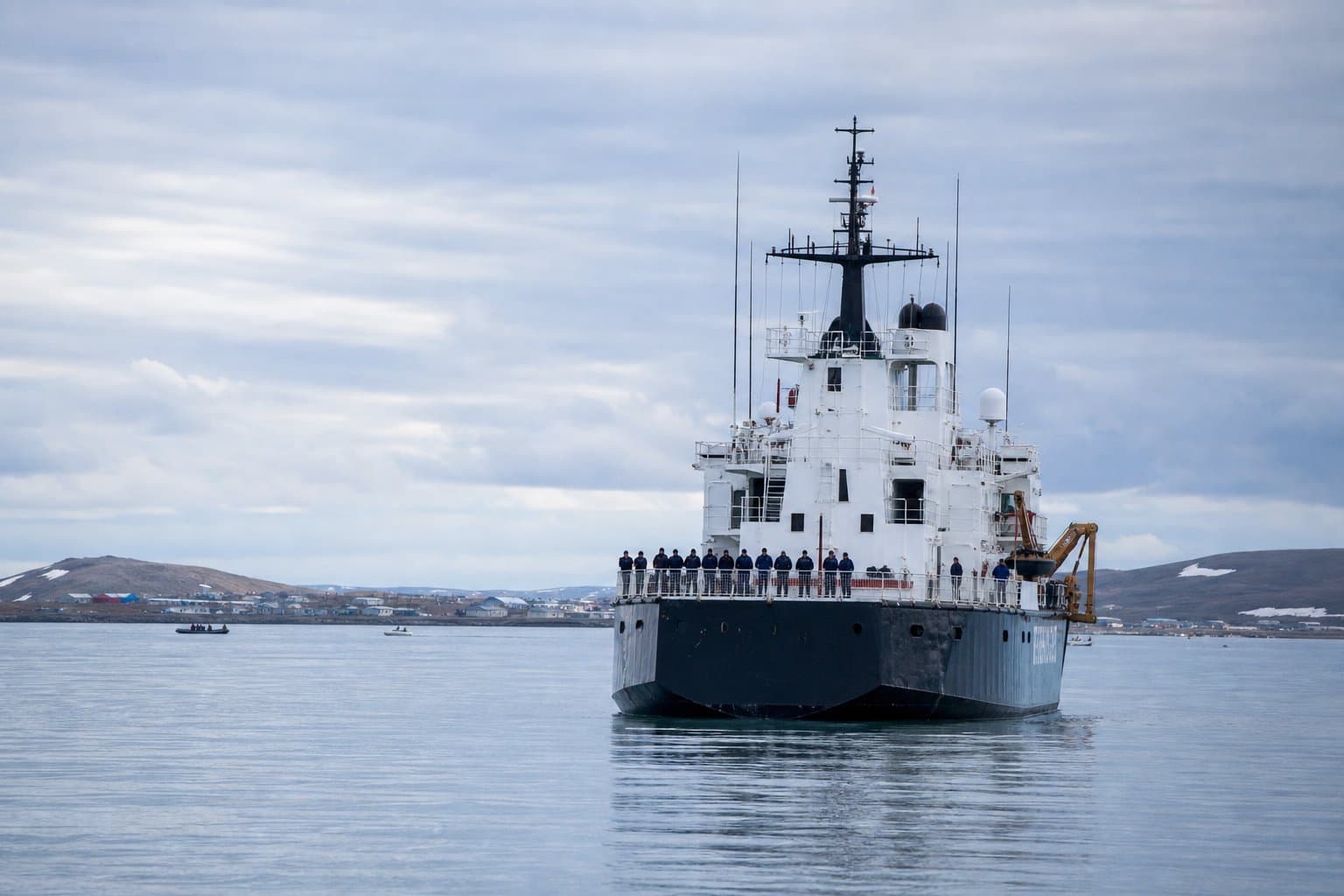 Cover image for article: Coast Guard cutter Stratton changes command at anchor off Kotzebue