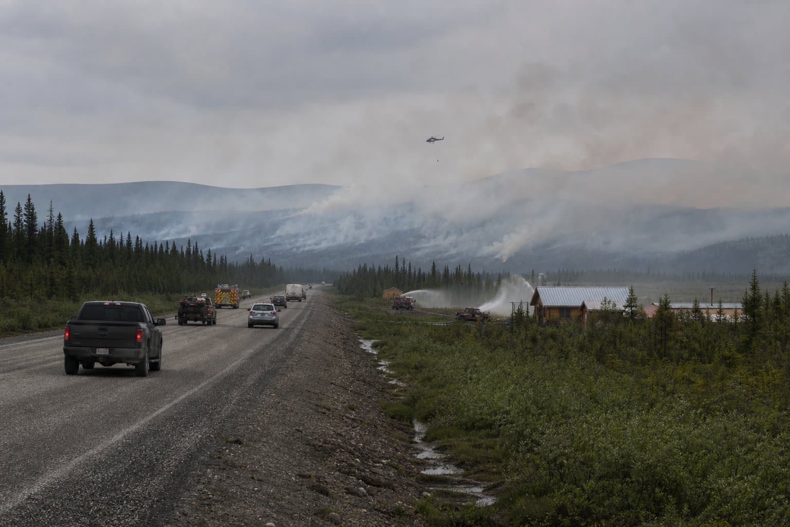 Cover image for article: Polly Fire holds one-third mile from Taylor Highway; crews deploy sprinklers
