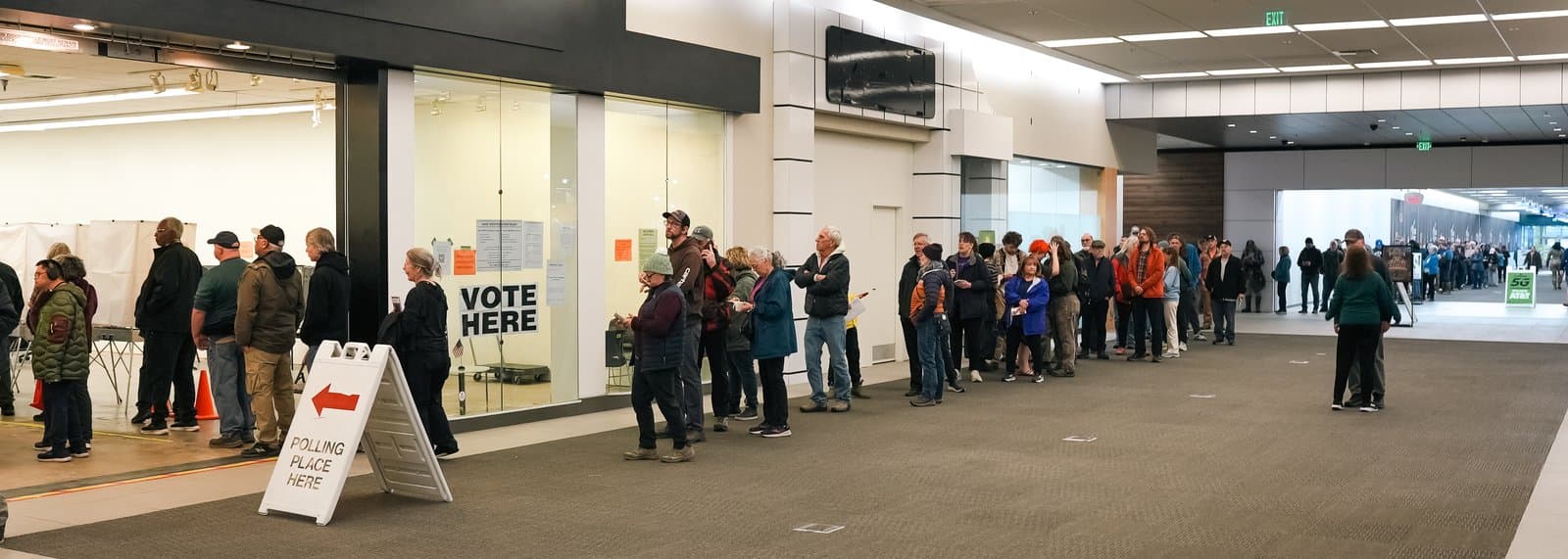 Voters line up at the early voting site inside Midtown Mall in Anchorage on Monday, the first day of early voting for the Nov. 3 general election.