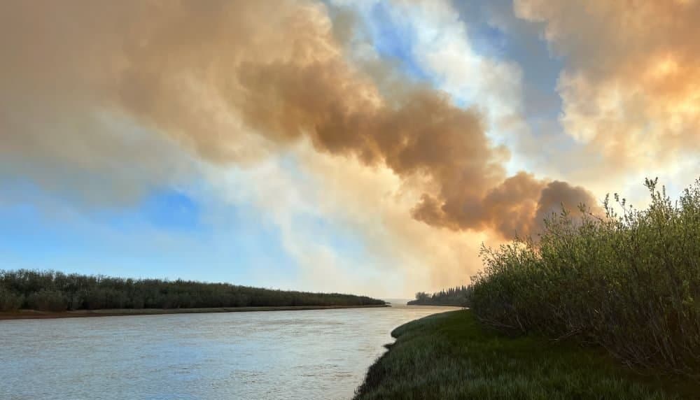 Cover image for article: A wildfire that started in a village landfill has burned to within a mile of Ambler — and warmer weather is coming