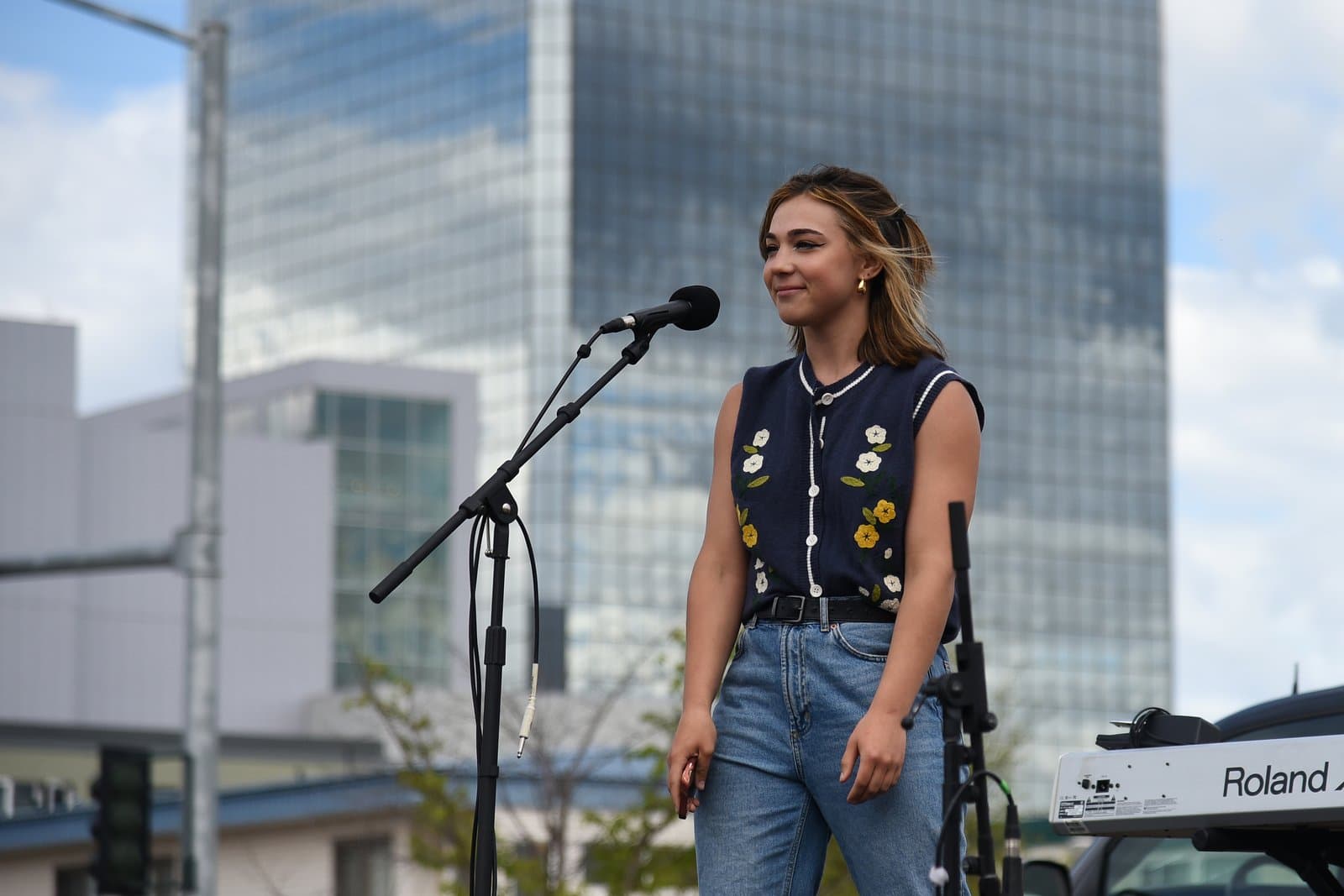 A young woman speaks into a microphone at a Planned Parenthood rally held in downtown Anchorage, Alaska, on July 9, 2022.
