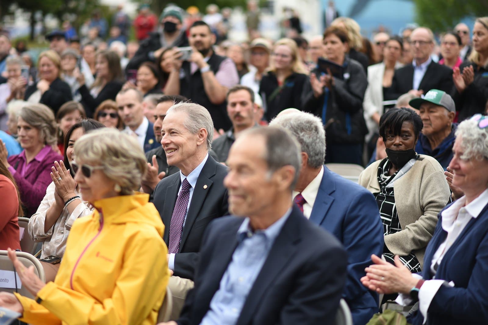 Matt Claman sits among a crowd of attendees during the inauguration ceremony for Mayor Suzanne LaFrance in Anchorage, Alaska.
