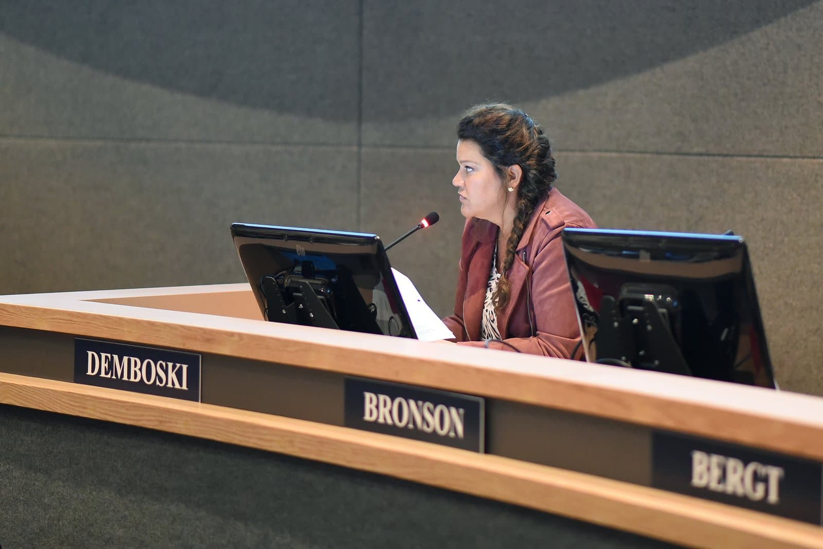 An Anchorage Assembly member speaks into a microphone during a public meeting held in Anchorage, Alaska, on October 7, 2021.