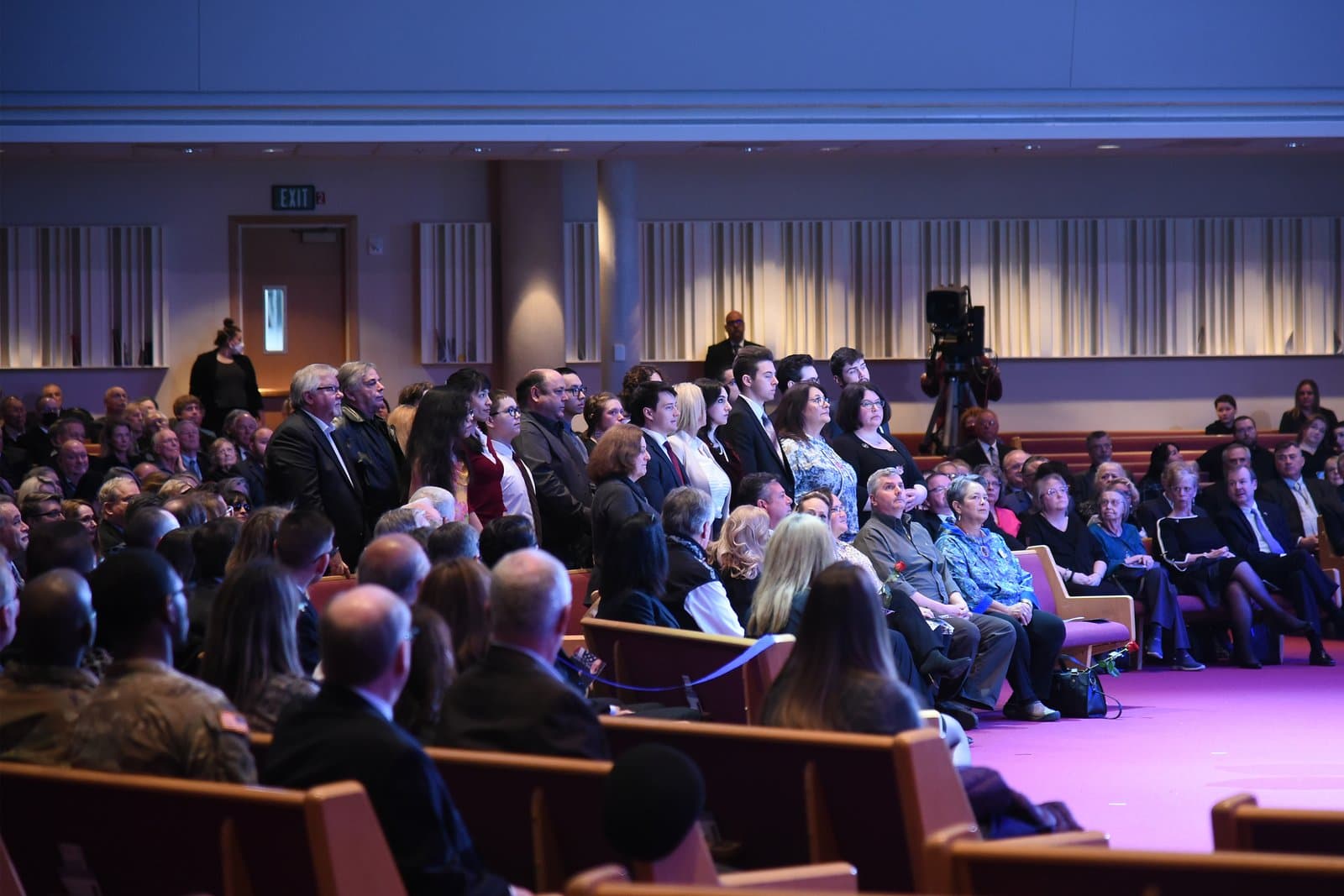 Attendees gather in a large auditorium for the memorial service of Congressman Don Young in April 2022.