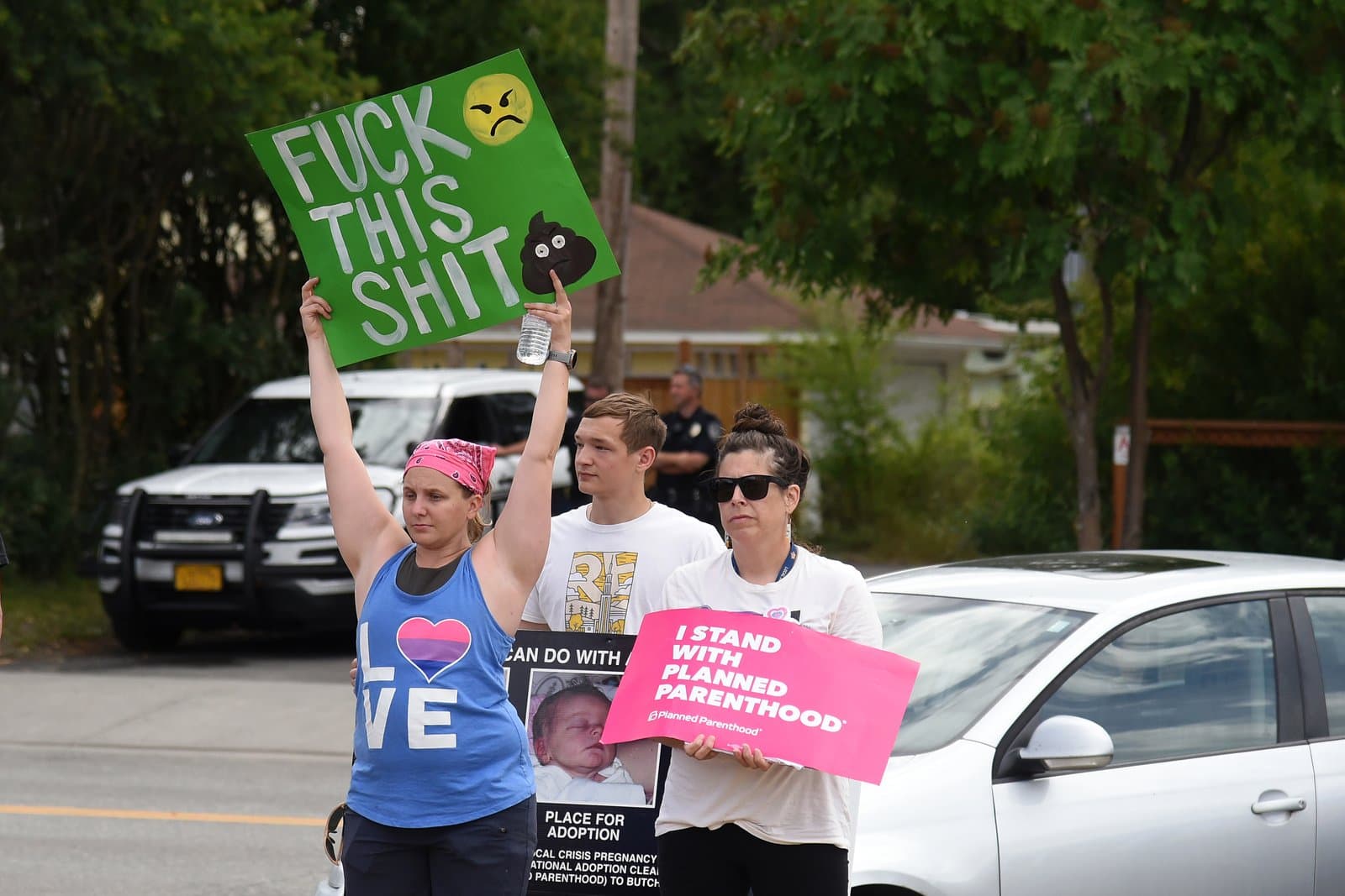 Protesters hold signs supporting Planned Parenthood and reproductive rights during a rally in downtown Anchorage, Alaska, on July 9, 2022.