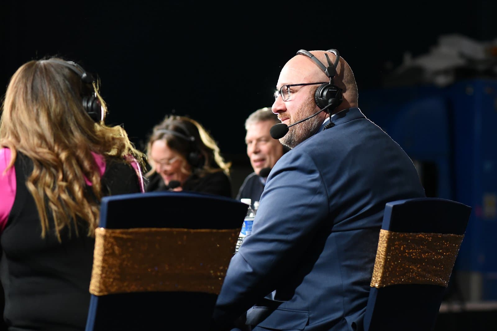 Panelists wearing headsets participate in a discussion at an Election Central event held in November 2024.