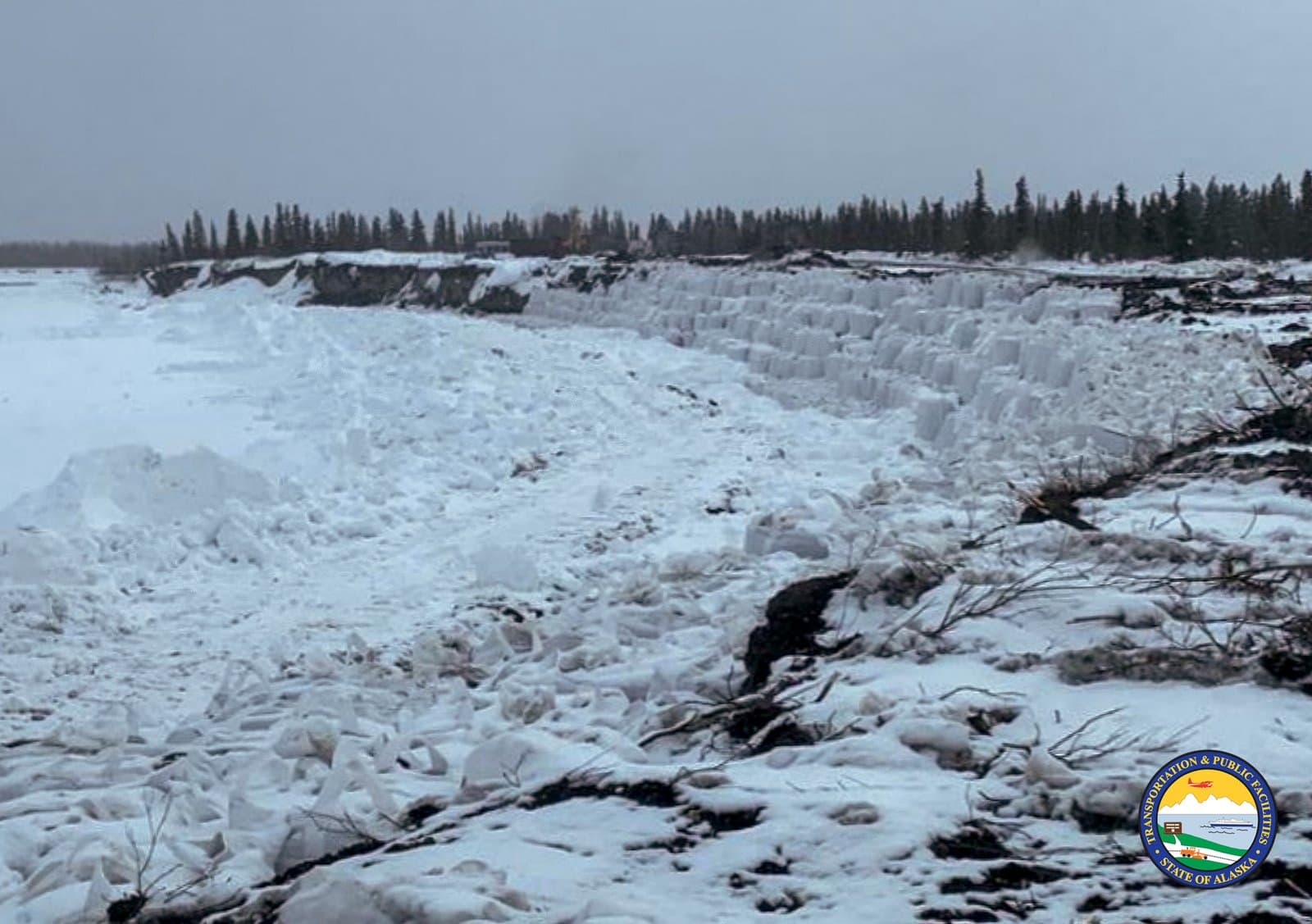 Large chunks of ice pile up along the snowy bank of the Noatak River during the spring breakup season in rural Alaska.